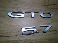 04-06 PONTIAC GTO LICENSE PLATE TRUNK FILLER PANEL GTO 5.7 BADGE EMBLEMS #164 picture