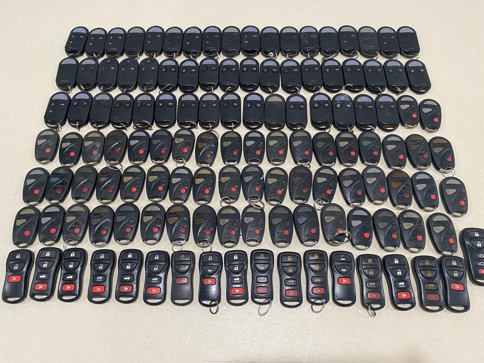 Lot of 125 Early OEM Factory Nissan Infiniti keyless entry remotes. ***Rare***