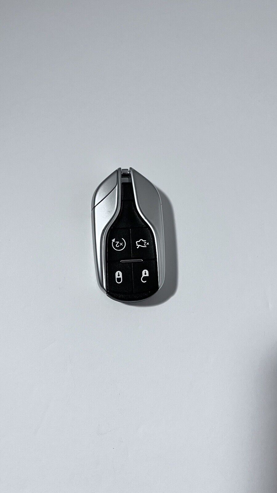 OEM Authentic Maserati key fob with new battery installed Silver & Blue
