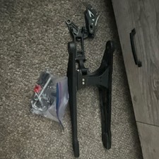 Talaria Mx5 subframe, chain tensioner, and axle picture