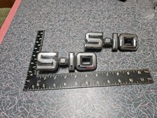 VINTAGE 1982-89 CHEVY S-10 TRUCK FENDER EMBLEMS OEM GM Part # 14041479 picture
