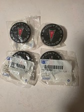 NOS SET FOUR PONTIAC AZTEK CENTER WHEEL CAPS picture