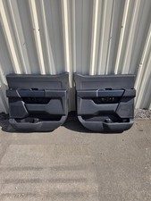OEM 2021-2026 Ford F-150 SuperCrew / Super Duty Rear Interior Door Trim Panels - picture