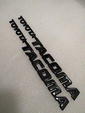 95 96 97 98 99-04 Toyota Tacoma Front Door Emblems Gloss Blk  **PAIR** picture