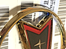 25530436 NOS Gold Bonneville Grille Emblem 1988-1991 picture