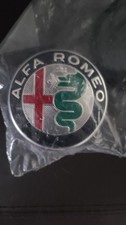 50543277 Alfa Romeo Wheel Center Caps Set of 4 New In Original Packaging. OEM picture
