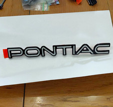 1984 - 1988 Pontiac Fiero Rear Fascia Emblem Silver Over Black NOS OEM GM Piece picture