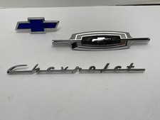 THREE VINTAGE CHEVROLET / CHEVY EMBLEMS / BADGES picture