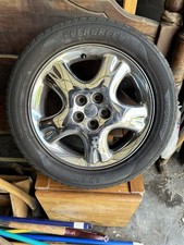 Four Chrome PT Cruiser Rims W/Tires On.  picture