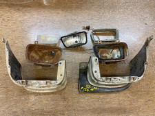 Pair of 53 Cadillac Radiator Extension Moldings Fog Lamp Housings and Bezel picture