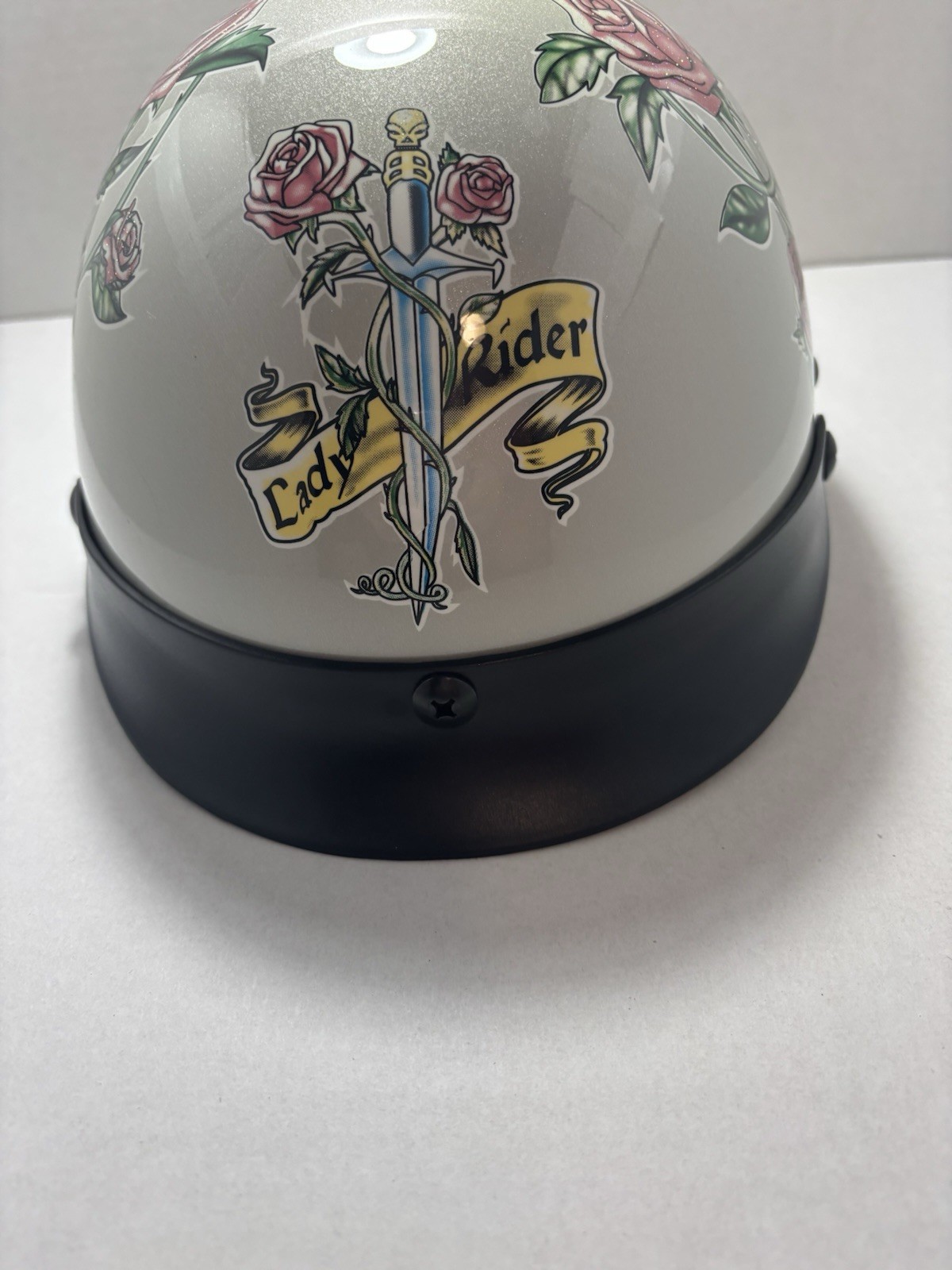 Women's large motorcycle helmet silver and rose graphic design Women's large motorcycle helmet silver and rose graphic design