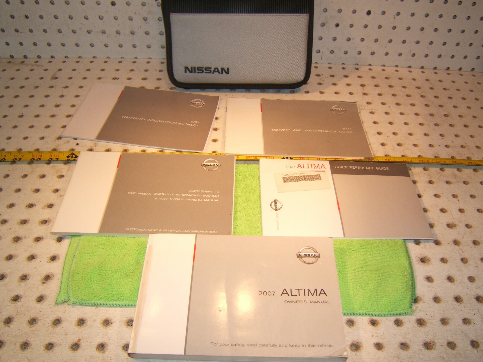 Genuine Nissan Altima 2007 owners Genuine OEM 1 set of 5Manuals & Nissan 1 Pouch