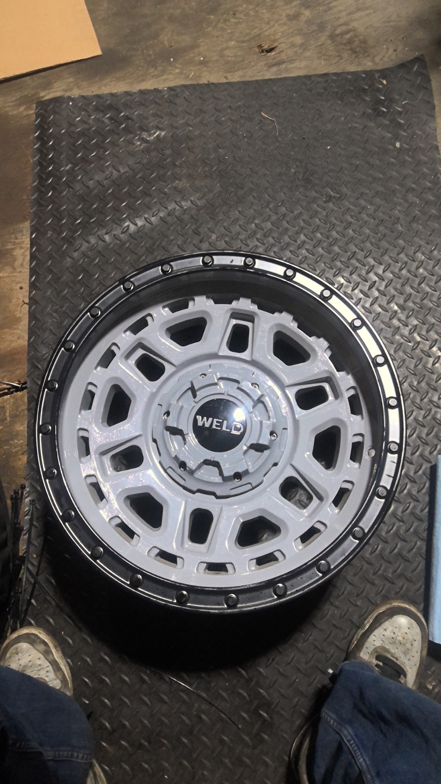 WELD OFF-ROAD Crux W169 17X9 6X135/6X139.7 ET0 Gloss Armor GRAY / Blk (Qty of 1) WELD OFF-ROAD Crux W169 17X9 6X135/6X139.7 ET0 Gloss Armor GRAY / Blk (Qty of 1)