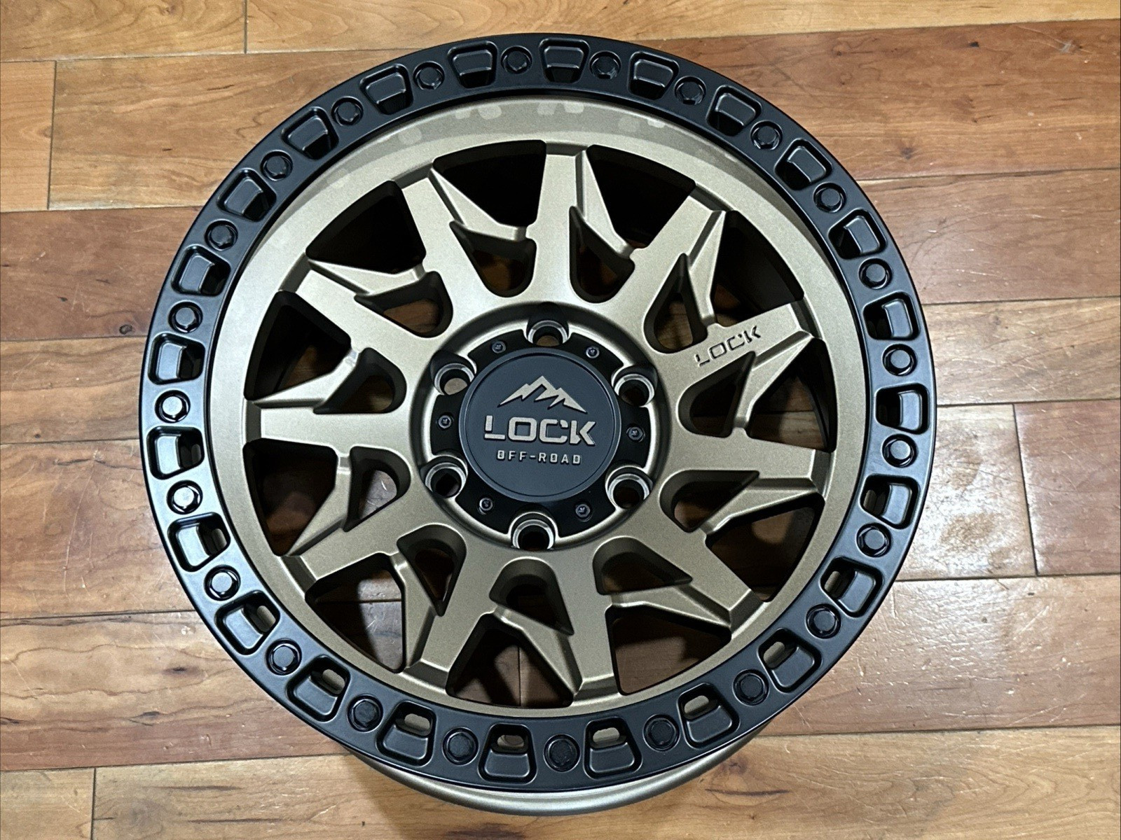 ONE 17X9 LOCK OFF-ROAD LUNATIC MATTE BRONZE W/BLACK RING 6X139.7 106.2 SILVERADO ONE 17X9 LOCK OFF-ROAD LUNATIC MATTE BRONZE W/BLACK RING 6X139.7 106.2 SILVERADO