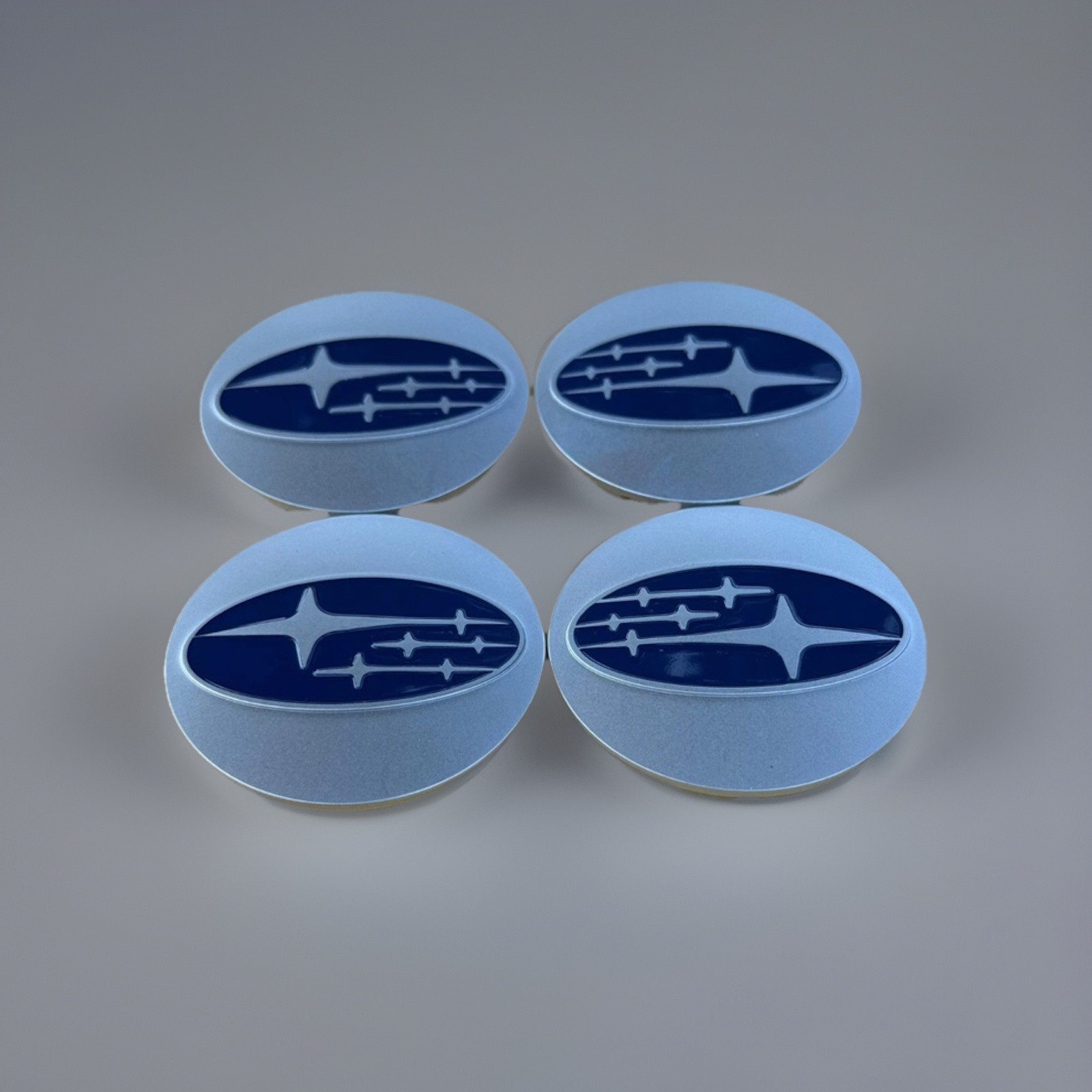 Set Of 4 Subaru Silver/Blue Wheel Center Cap, 28821SA030 Set Of 4 Subaru Silver/Blue Wheel Center Cap, 28821SA030