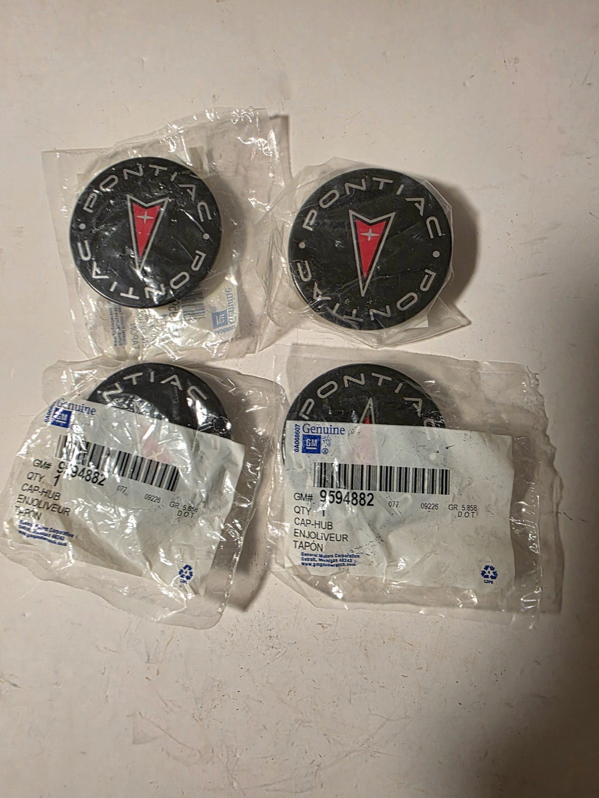 NOS SET FOUR PONTIAC AZTEK CENTER WHEEL CAPS NOS SET FOUR PONTIAC AZTEK CENTER WHEEL CAPS