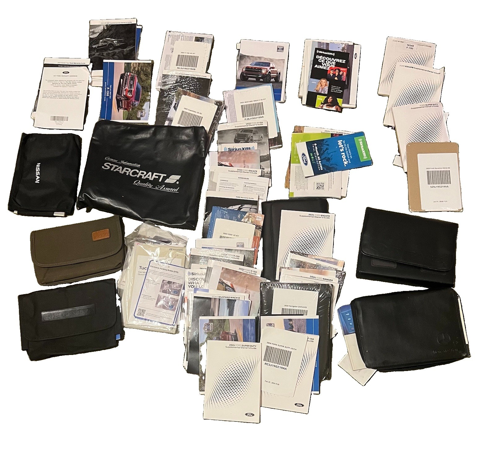 LOT OF MISC CAR & TRUCK OWNERS MANUALS,SUPPLEMENTS AND CASES 22lbs LOT OF MISC CAR & TRUCK OWNERS MANUALS,SUPPLEMENTS AND CASES 22lbs