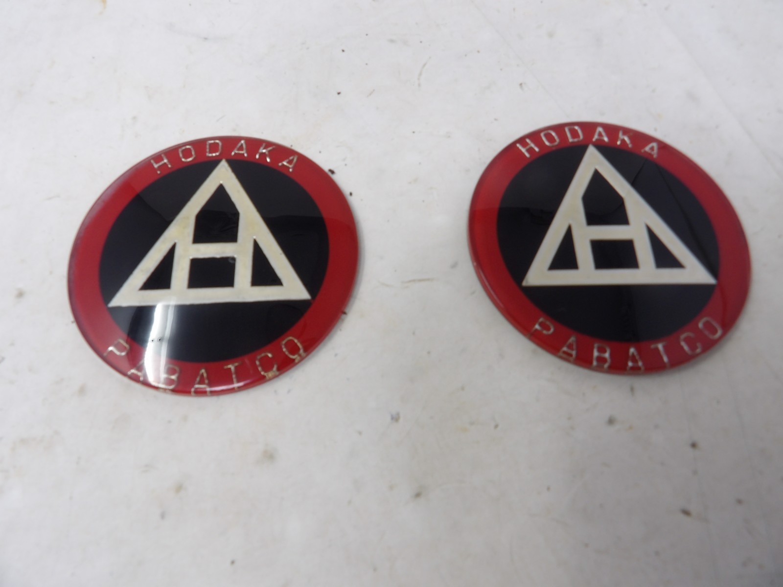 Pair of New NOS Hodaka Gas Tank Badges 909011 Models 90, 92, 93, 94, 95, 96 Pair of New NOS Hodaka Gas Tank Badges 909011 Models 90, 92, 93, 94, 95, 96