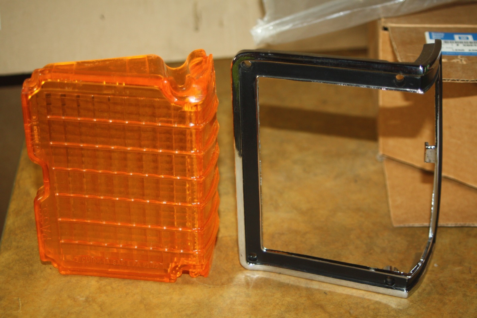 NOS 1972 Chevelle OEM Park Lamp Lens - Amber - Left Hand - GM 5965269 + Bezel NOS 1972 Chevelle OEM Park Lamp Lens - Amber - Left Hand - GM 5965269 + Bezel