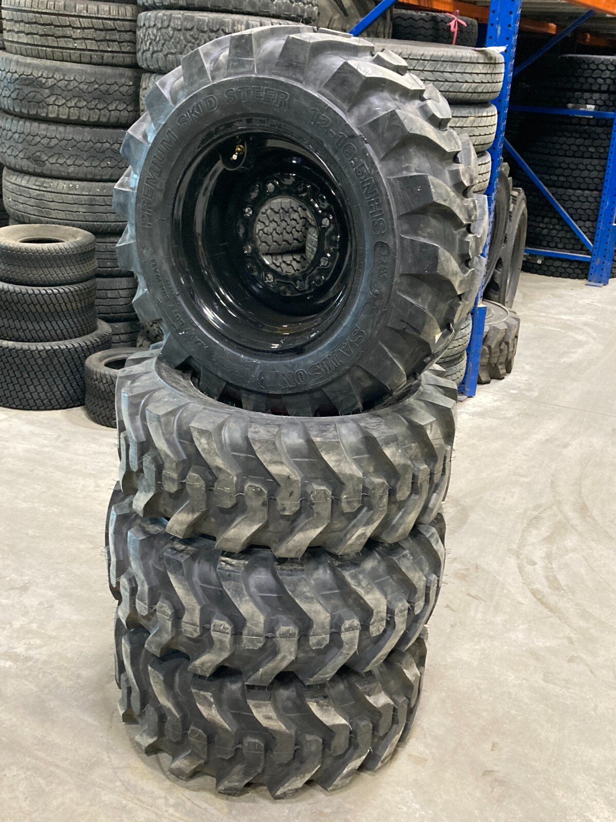 4 New 12 16.5 Skid Steer Tires Mounted BLACK 8 Hole Rims MRL R4 Prem 24/32