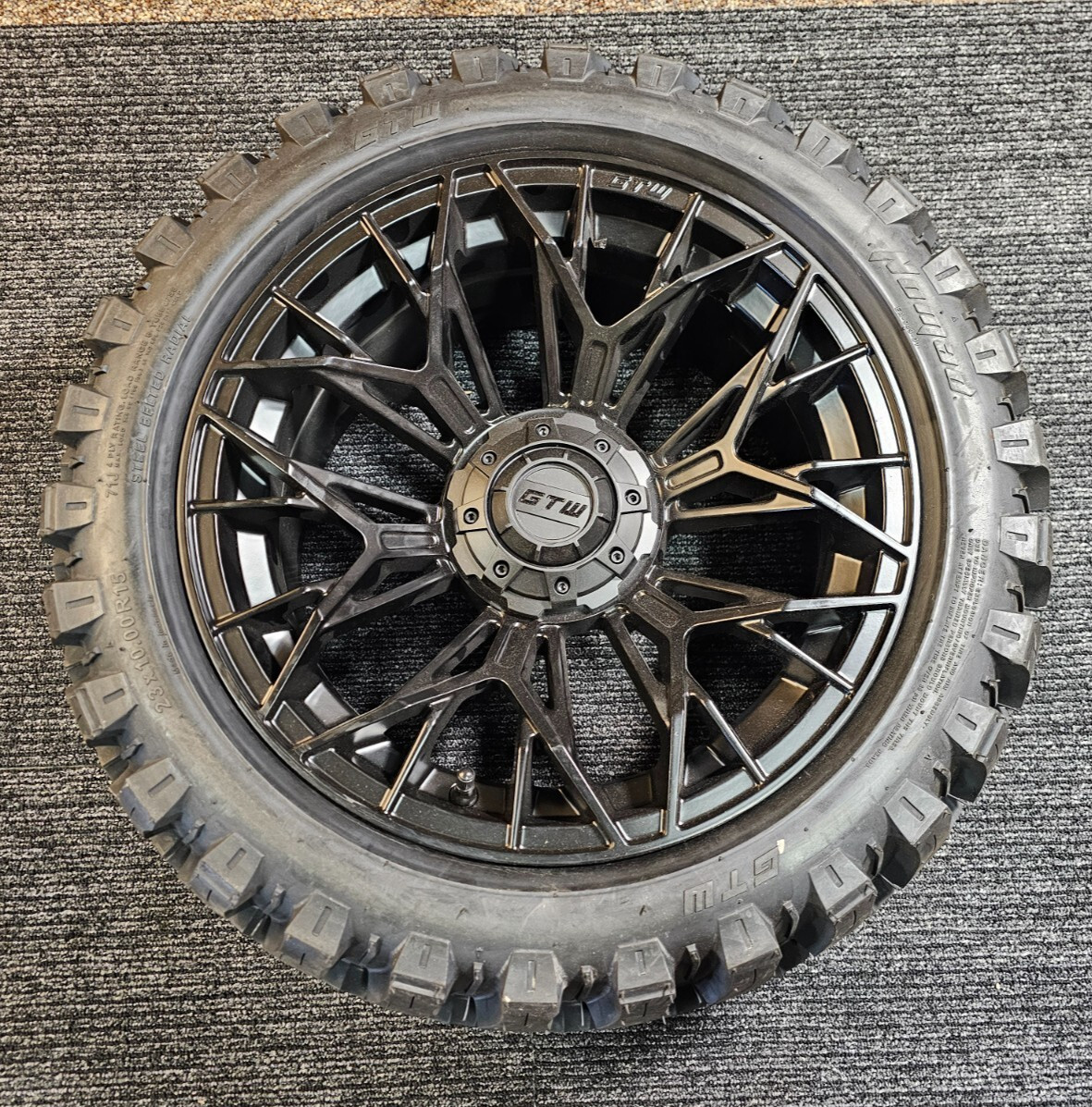 (QTY 1) GTW 71J 23x10.00R15 Nomad Golf Cart Tire on GTW Stellar 15x7 4x101.6 Rim (QTY 1) GTW 71J 23x10.00R15 Nomad Golf Cart Tire on GTW Stellar 15x7 4x101.6 Rim