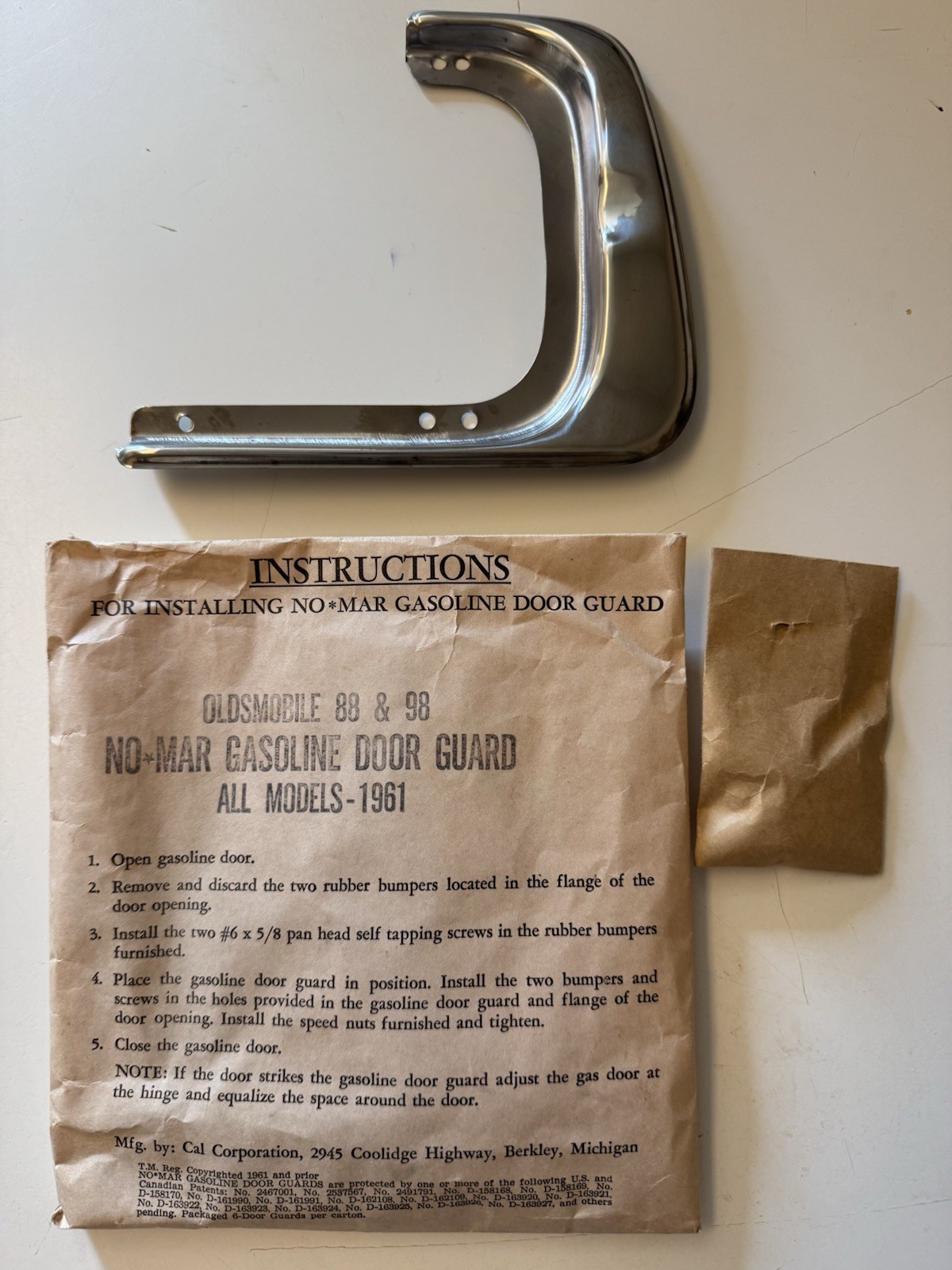 NOS 1961 Oldsmobile Starfire 88 & 98 Gas Door Guard NOS 1961 Oldsmobile Starfire 88 & 98 Gas Door Guard