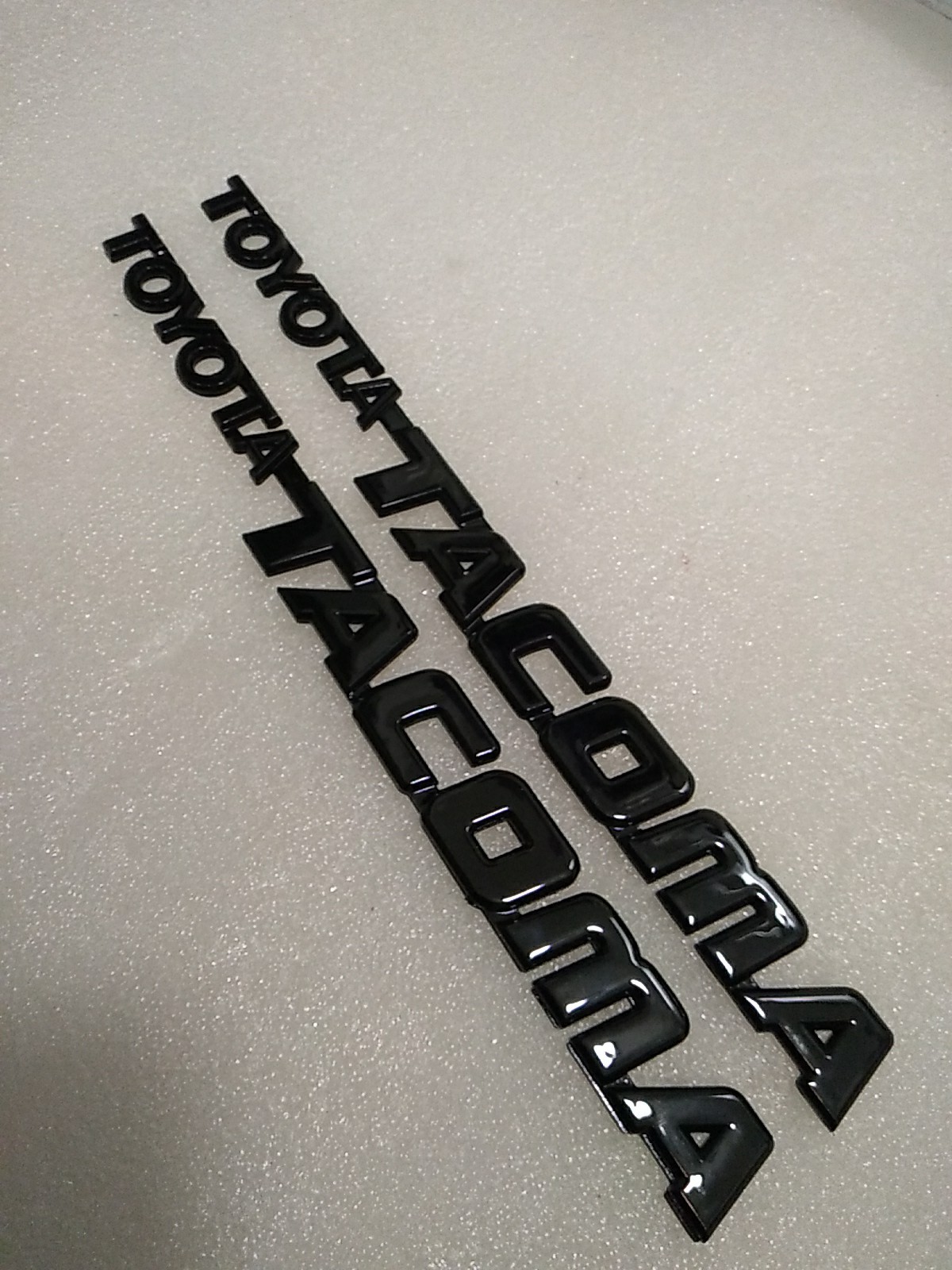 95 96 97 98 99-04 Toyota Tacoma Front Door Emblems Gloss Blk  **PAIR**