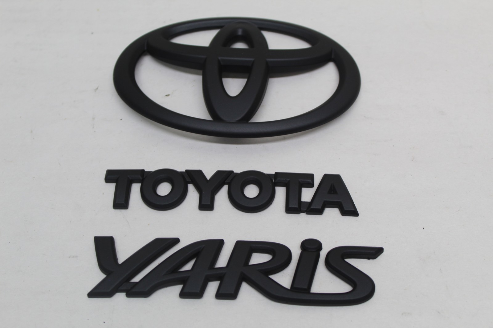 2007 - 2012 TOYOTA YARIS SEDAN EMBLEM LOGO BADGE SET OEM 2007 - 2012 TOYOTA YARIS SEDAN EMBLEM LOGO BADGE SET OEM
