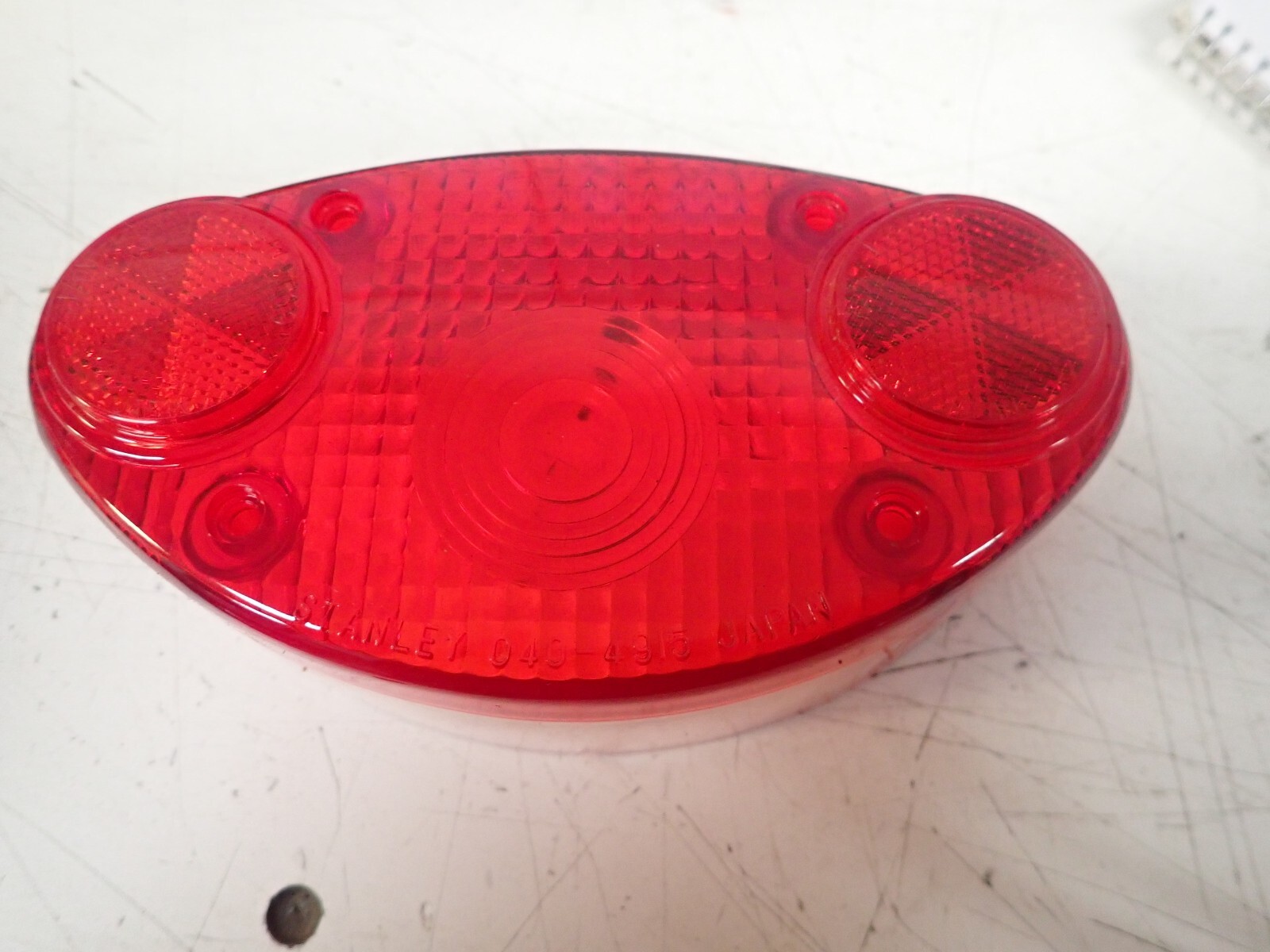 NOS 1973 1974 1975 1976 Kawasaki KH500 H1 Tail light Lens Stanley 040-4915 NOS 1973 1974 1975 1976 Kawasaki KH500 H1 Tail light Lens Stanley 040-4915