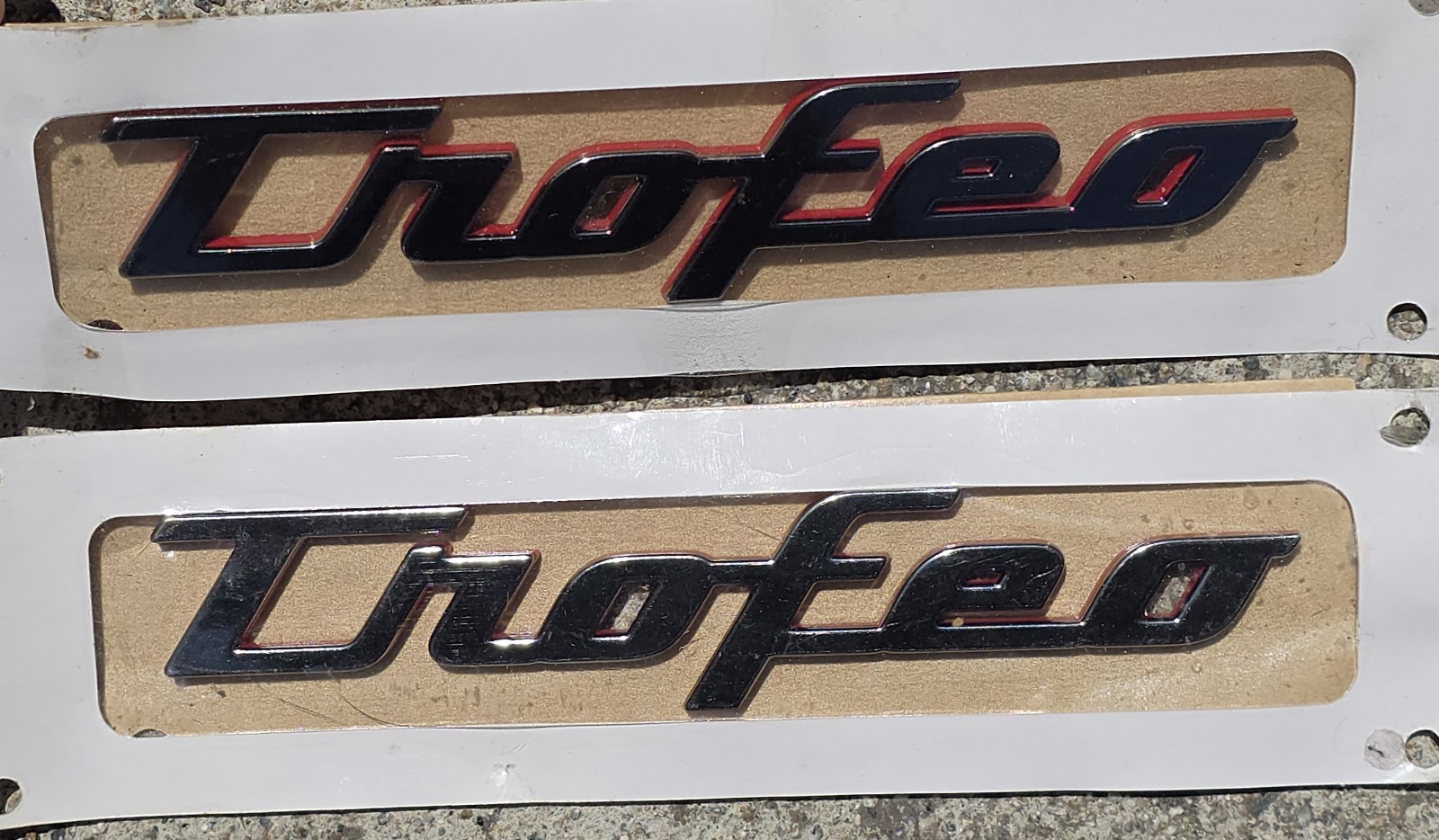 Genuine Maserati Trofeo Fender Badges Set Of 2 Chrome With Red OEM Genuine Maserati Trofeo Fender Badges Set Of 2 Chrome With Red OEM