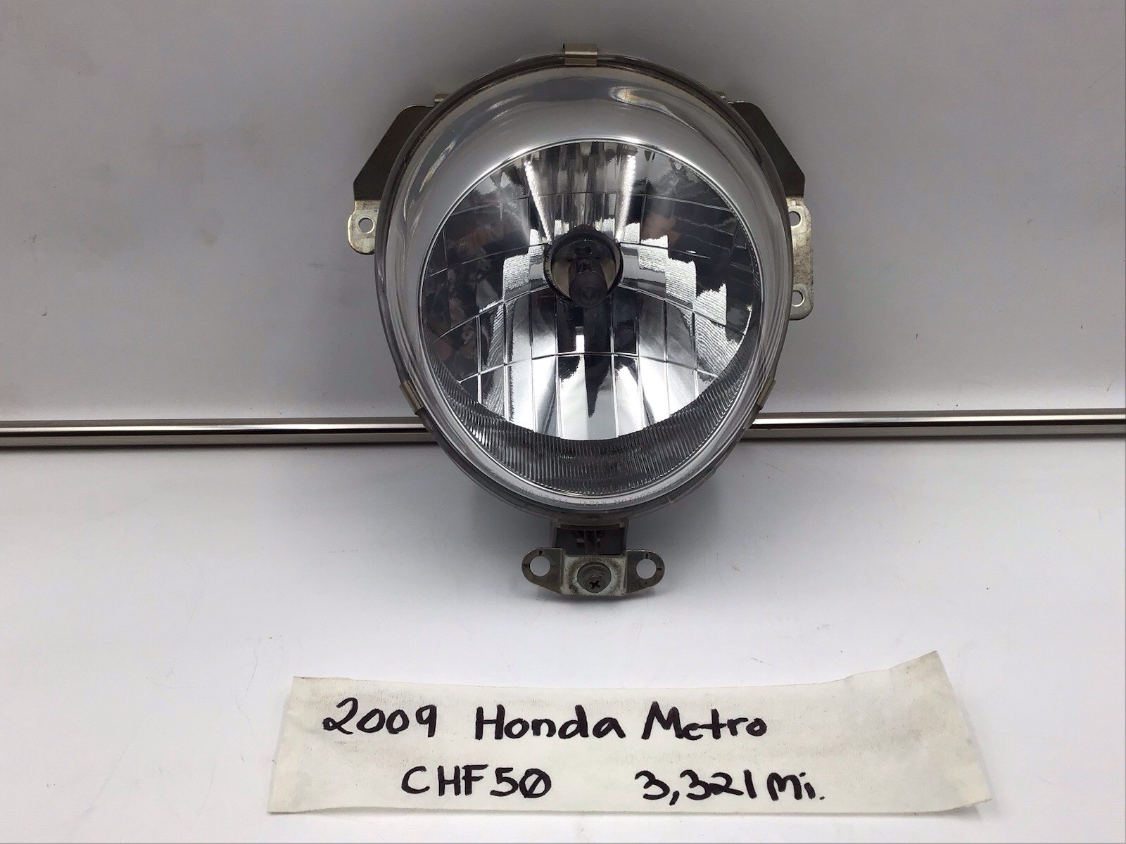 OEM 2009 Honda Metropolitan CHF50 Complete Headlight Assembly 33101-GET-671 OEM 2009 Honda Metropolitan CHF50 Complete Headlight Assembly 33101-GET-671