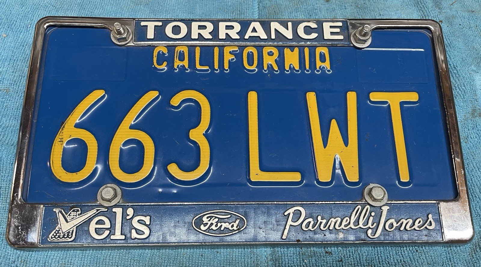 Vintage Vel’s Parnelli Jones Torrance CA License Plate Frame Blue Plate OEM ￼ no