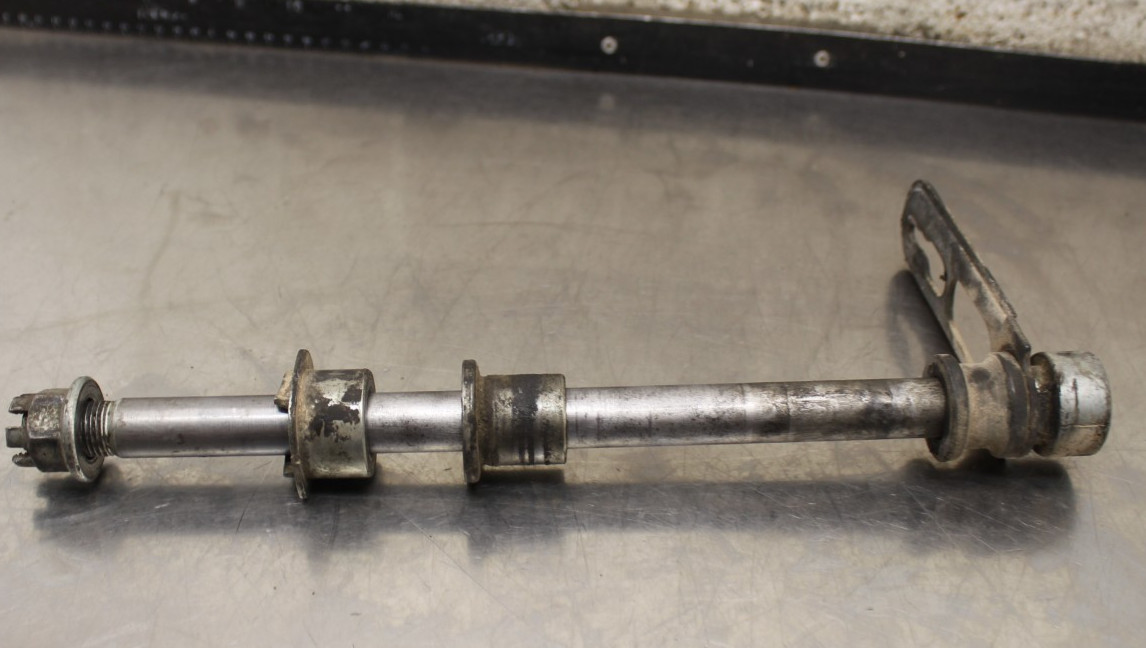 1981 Honda 250S XL REAR AXLE W/ SPACERS AND BRAKE BRACKET P904.5