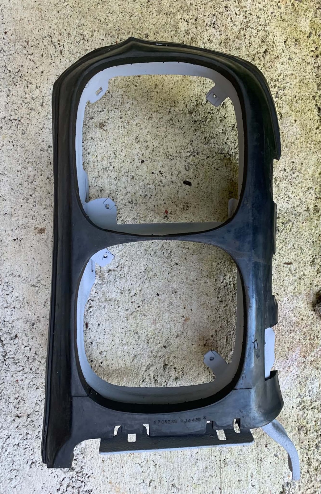 1969 Firebird Driver Left Headlight Surround Frame with Rubber Filler 1969 Firebird Driver Left Headlight Surround Frame with Rubber Filler