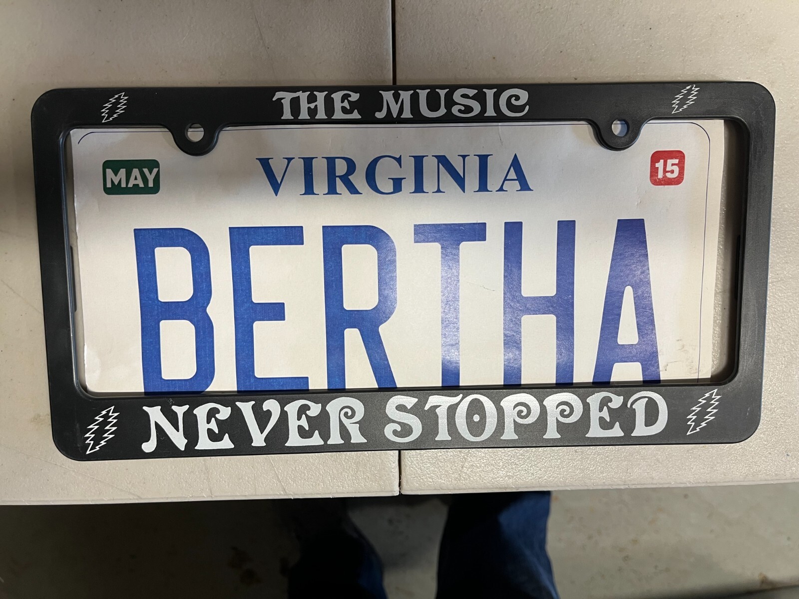 Grateful Dead license plate frame : THE MUSIC NEVER STOPPED Grateful Dead license plate frame : THE MUSIC NEVER STOPPED