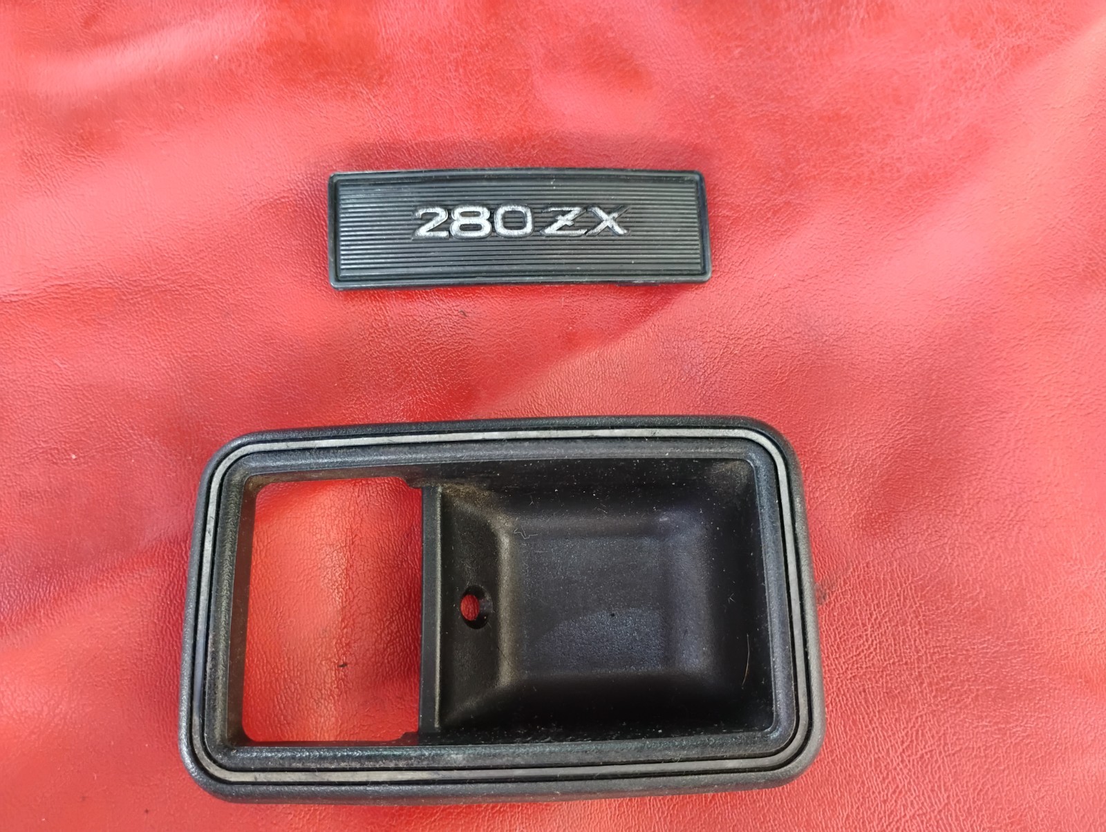 Datsun 1979-83 280zx OEM Door Escutcheon & Center Console Emblem