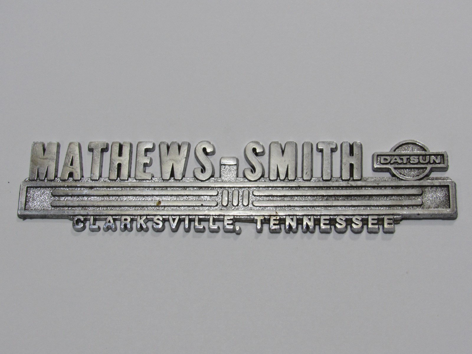 VTG Mathews-Smith Datsun Clarksville Tennessee Metal Dealership Badge Emblem Tag VTG Mathews-Smith Datsun Clarksville Tennessee Metal Dealership Badge Emblem Tag