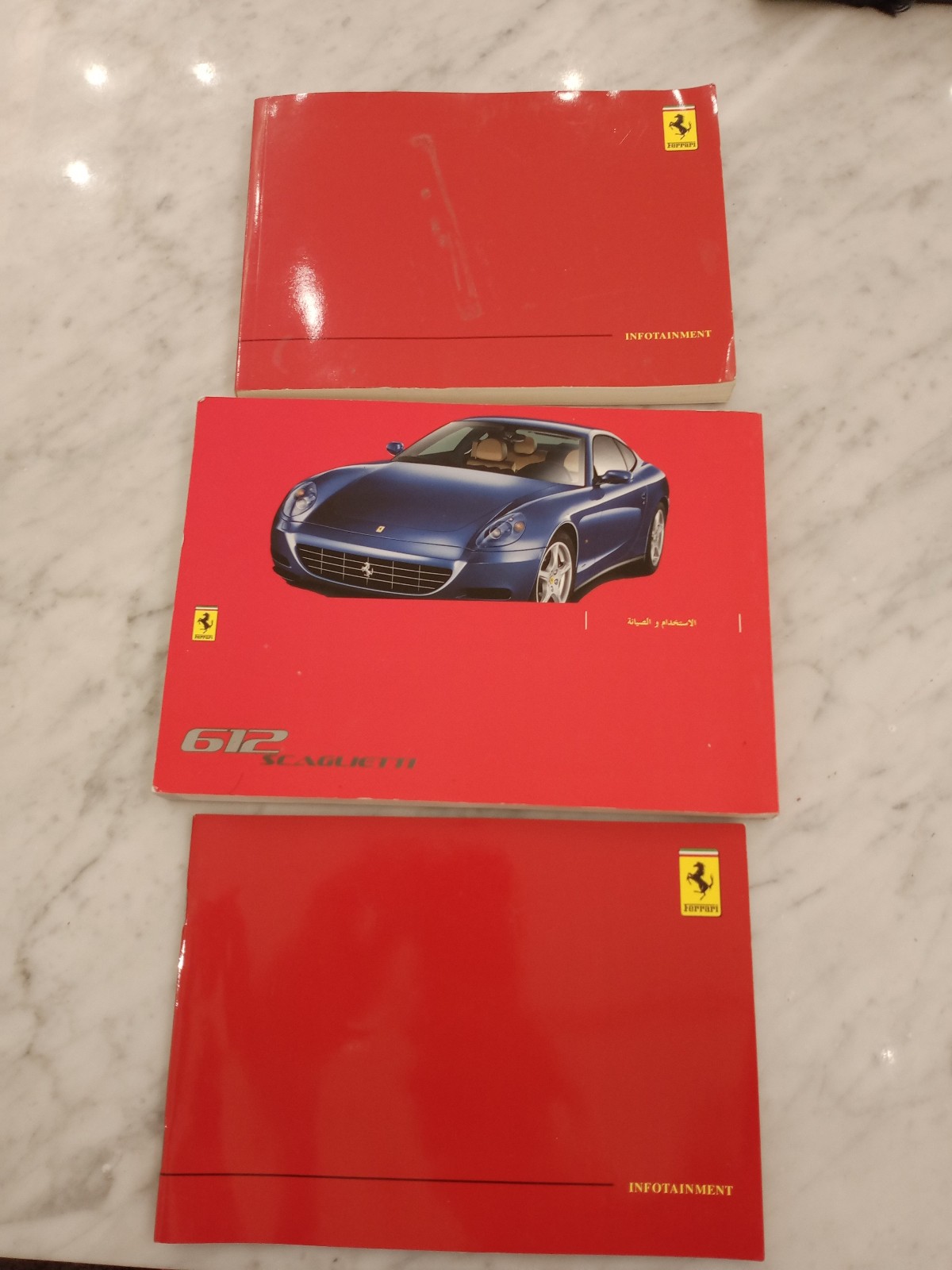 Ferrari 612 owners manual + 2 infotainment booklets (Arabic + English) RARE Ferrari 612 owners manual + 2 infotainment booklets (Arabic + English) RARE