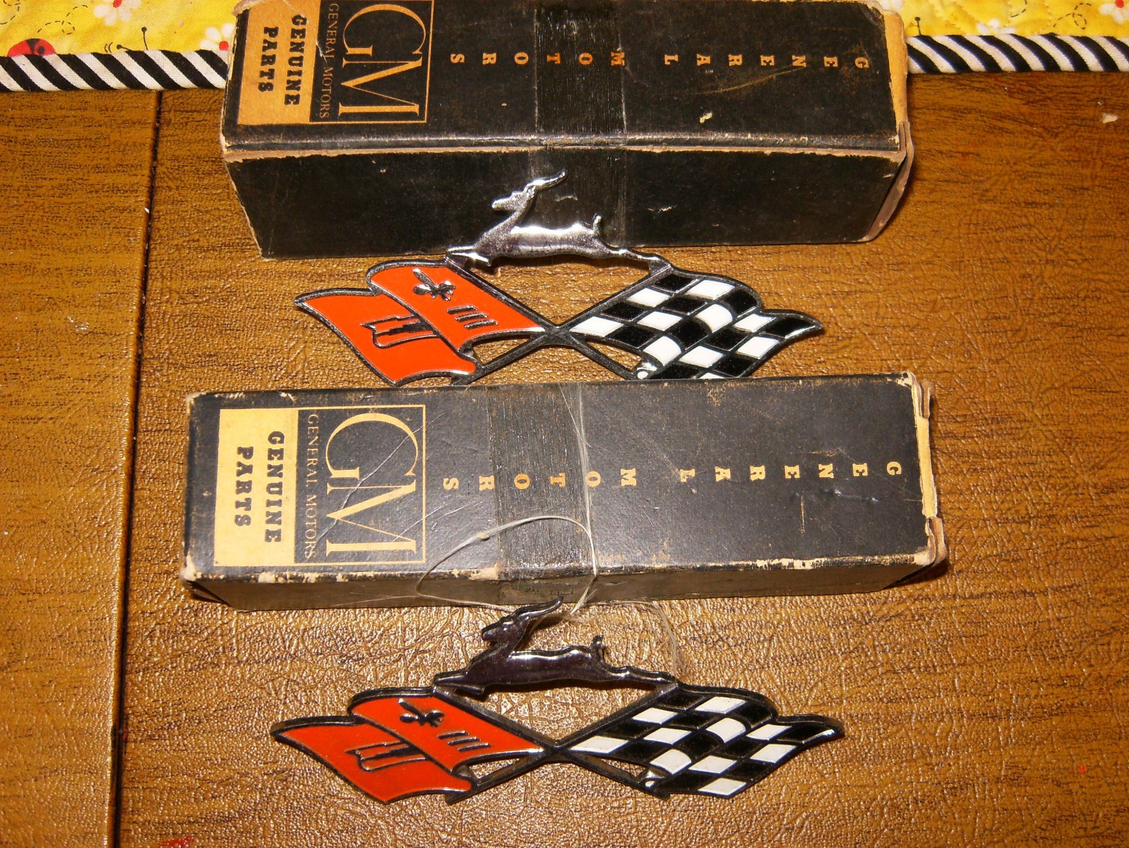 NOS 1961 Impala Quarter Panel PAIR Crossed Flag Emblems in Original GM Boxes