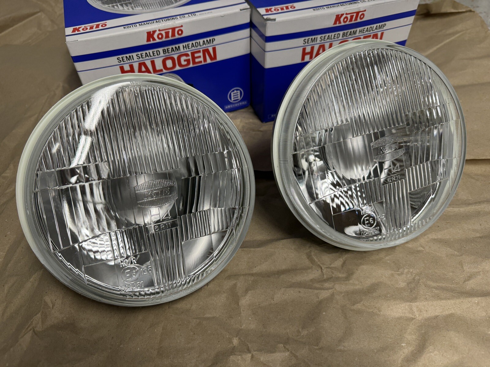 New Pair KOITO 7” Round Headlights H4 Light Bulbs Euro Japan OEM Replacement