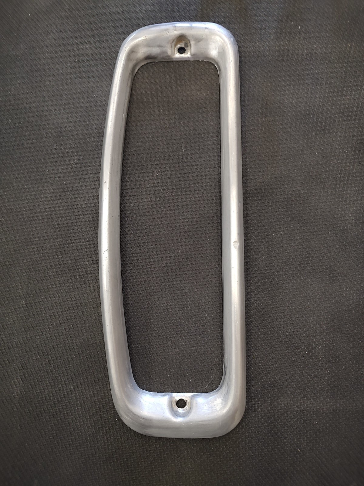 1966-1977 FORD EARLY BRONCO REAR TAIL LIGHT BEZEL - DRIVERS SIDE 1966-1977 FORD EARLY BRONCO REAR TAIL LIGHT BEZEL - DRIVERS SIDE