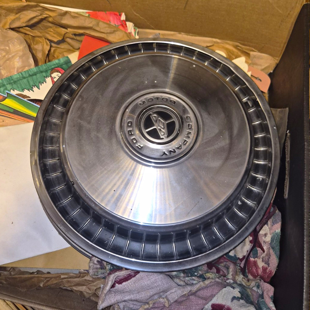 4 vintage Ford Hubcaps