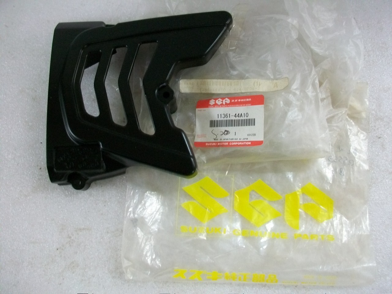 NOS New OEM 1985-1988 Suzuki DR125 Sprocket Cover DR 125 NOS New OEM 1985-1988 Suzuki DR125 Sprocket Cover DR 125